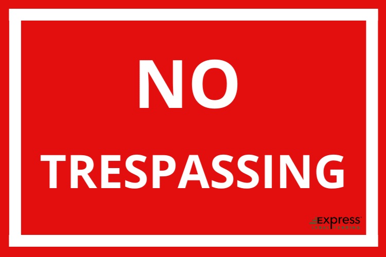 No Trespassing sign with white letters and red background.