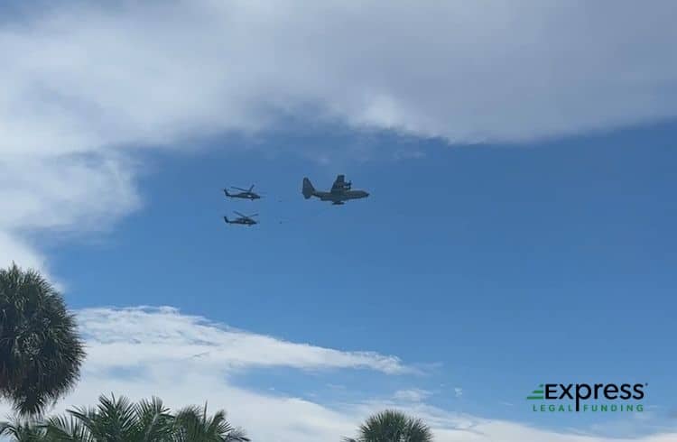 Two US Military Helicopters and Transport Plane Flying