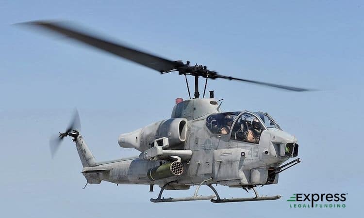 An AH-1W Super Cobra Military Helicopter Taking Off.