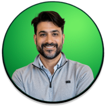 Professional portrait of Shawn Hashmi, CEO of Express Legal Funding, smiling in front of a green circular background used for company quotes.